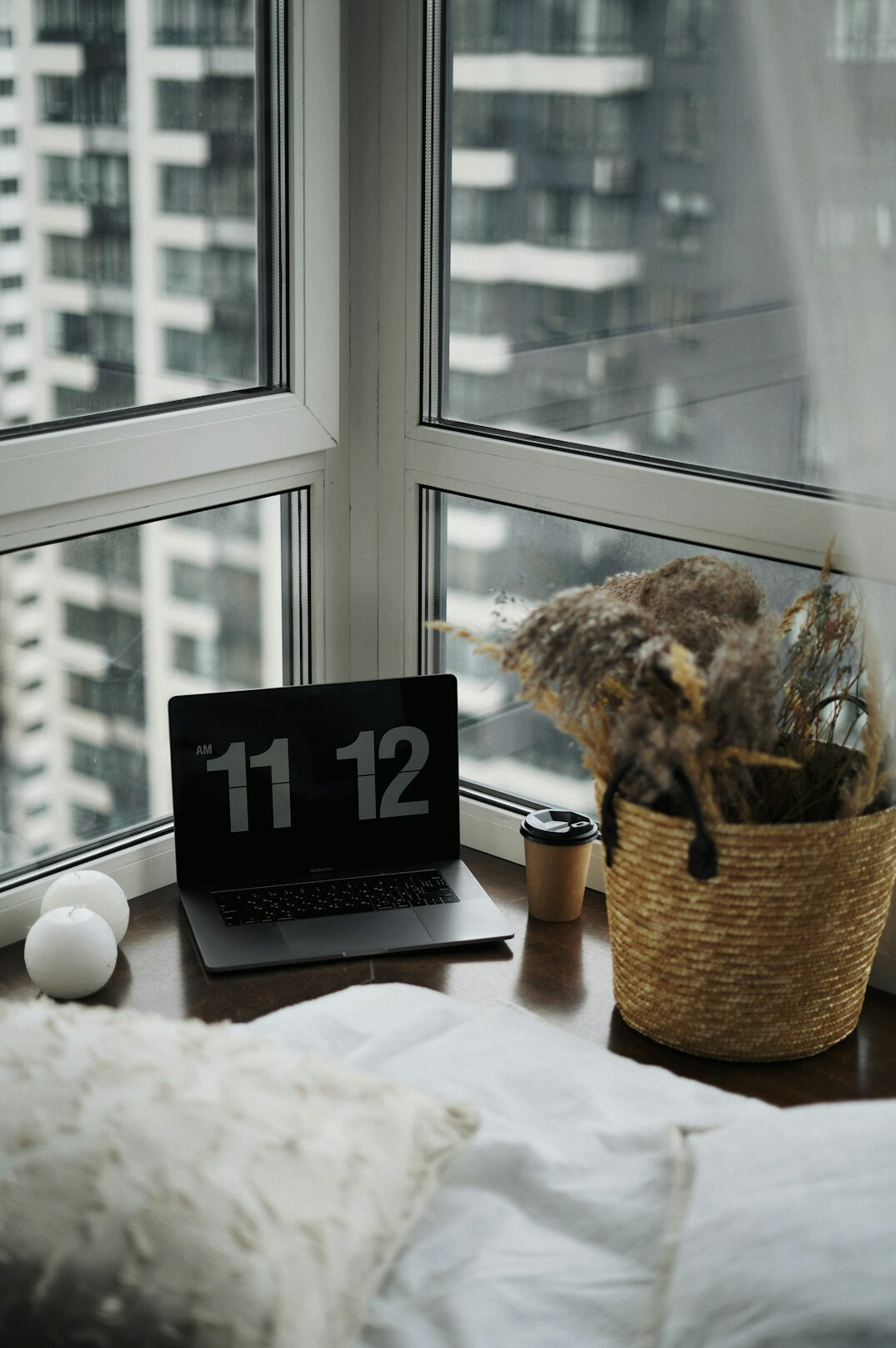 Workspace with a laptop and notes used for editing preparation